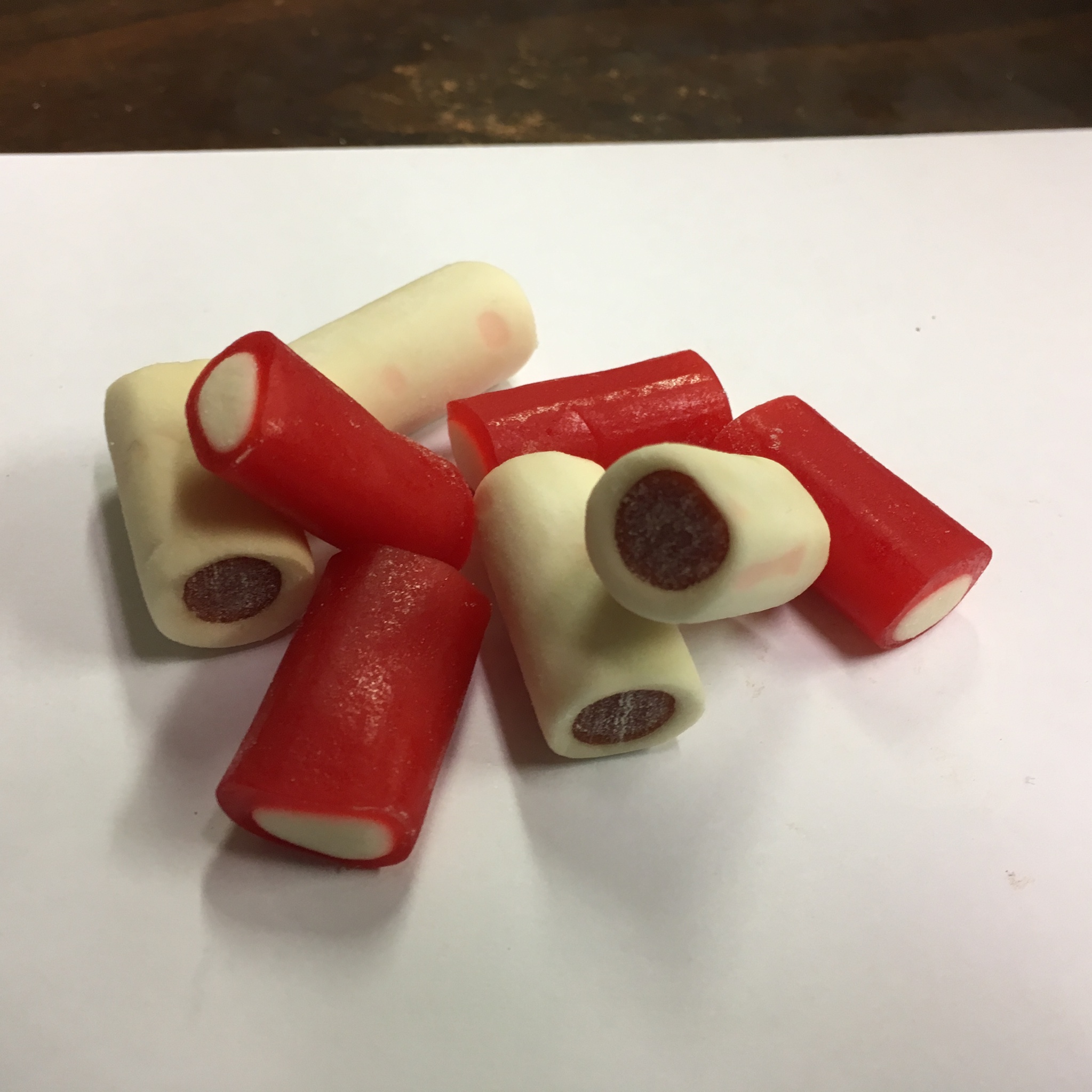 Red and white filled licorice logs